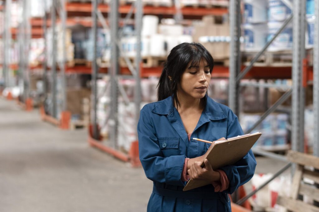 Woman Worker Taking Notes Warehouse